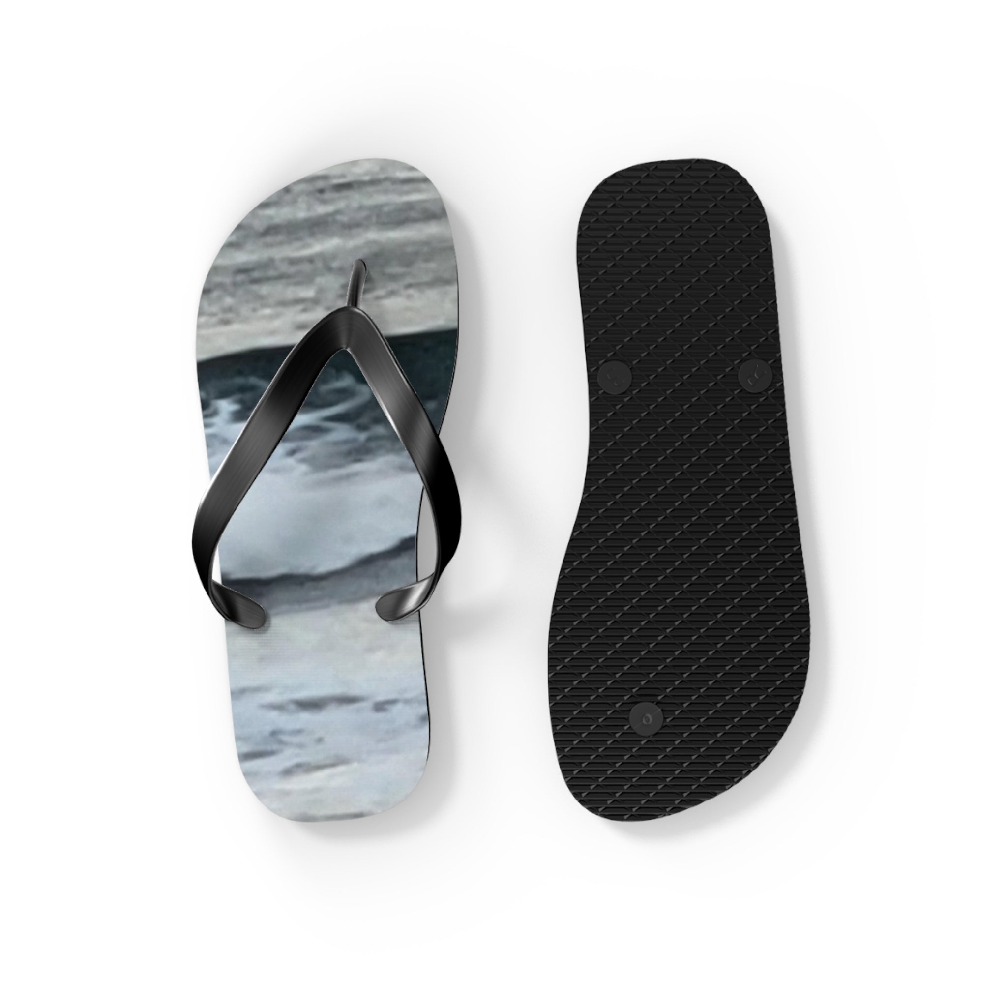 Black flip-flops with a marbled blue and white sole pattern.