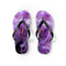 Purple floral flip-flops with black straps on a white background.