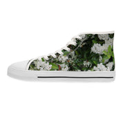 White high-top sneaker with white flowers and green leaves print.