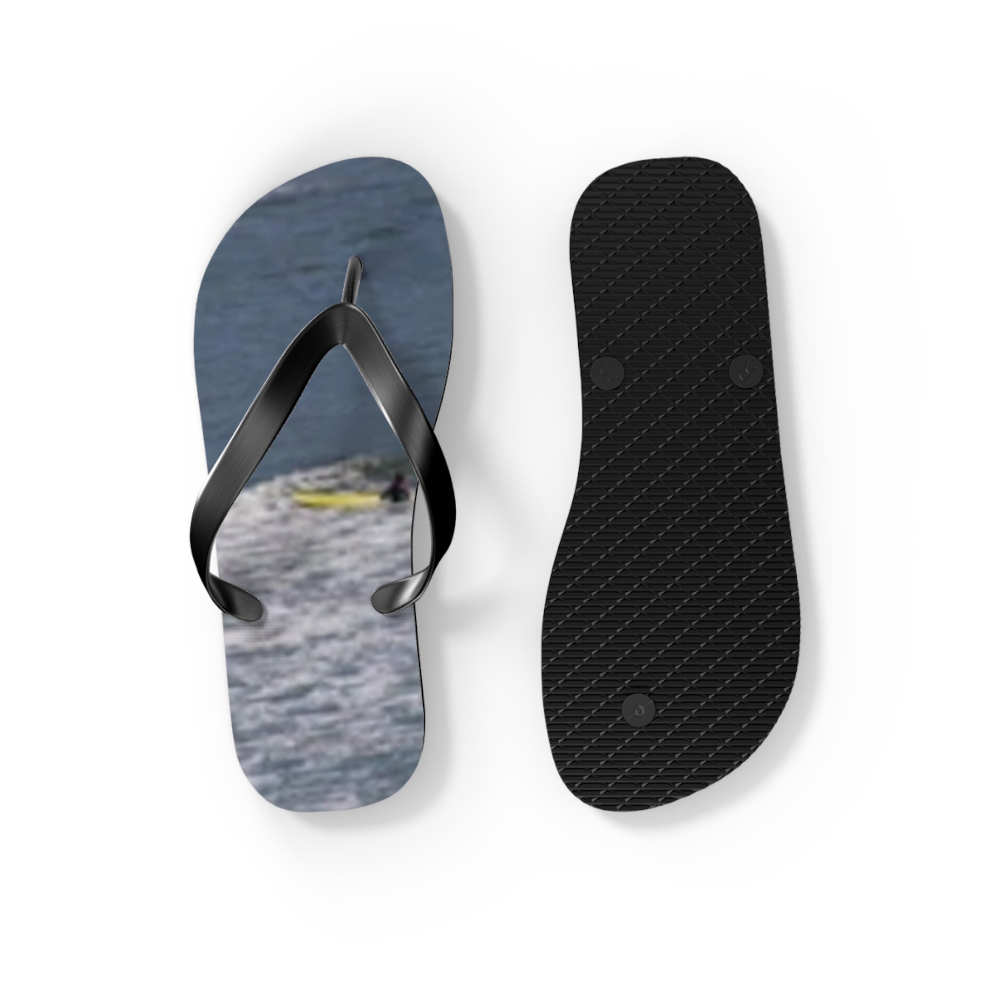 Flip-flops with a water scene featuring a kayaker on the left and sole on the right.