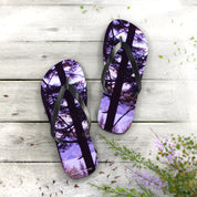 Flip-flops with a forest landscape and purple sky print.