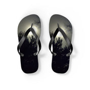 Flip flops with a dark, moonlit forest silhouette.