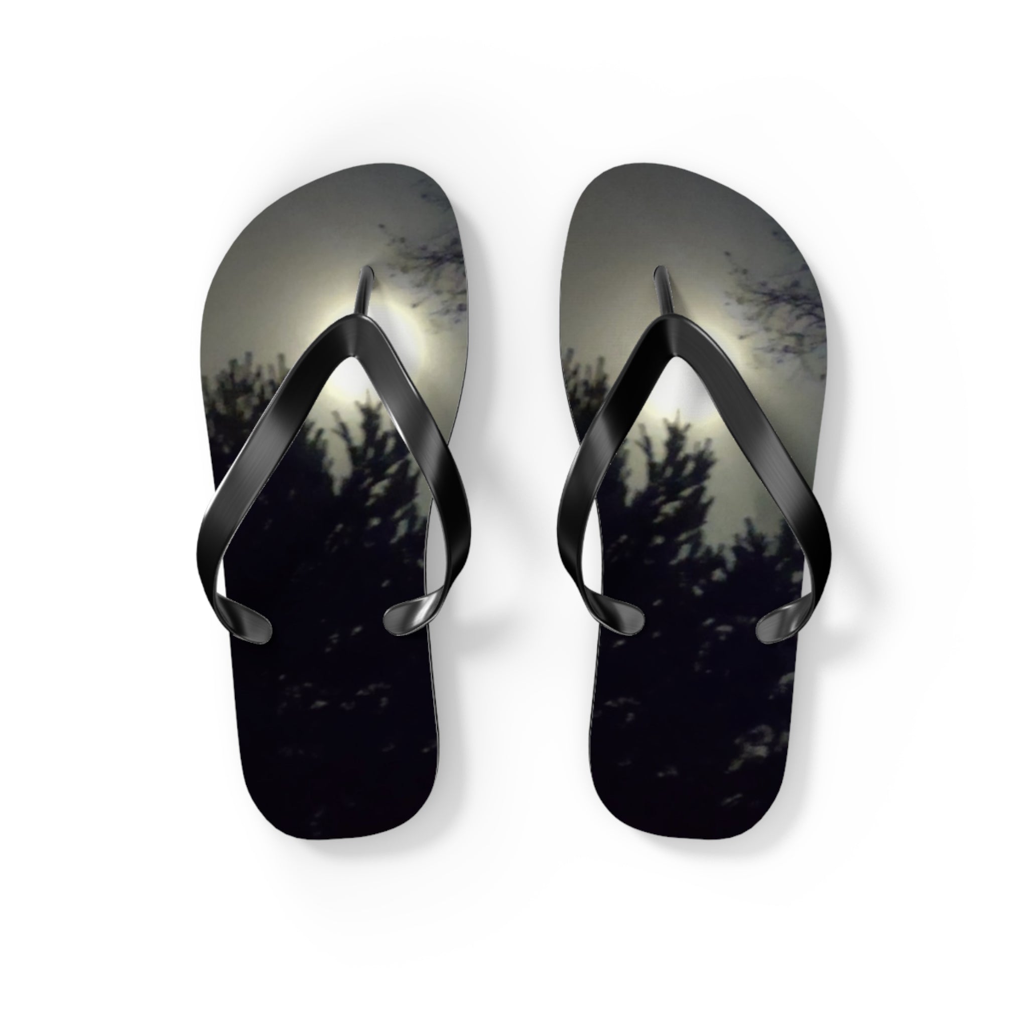 Flip flops with a dark, moonlit forest silhouette.