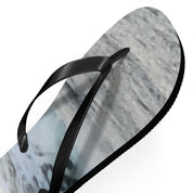 Black flip-flop sandal with a gray and white abstract pattern on the sole.