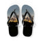 Flip-flops with a sunset landscape featuring trees and a hillside.