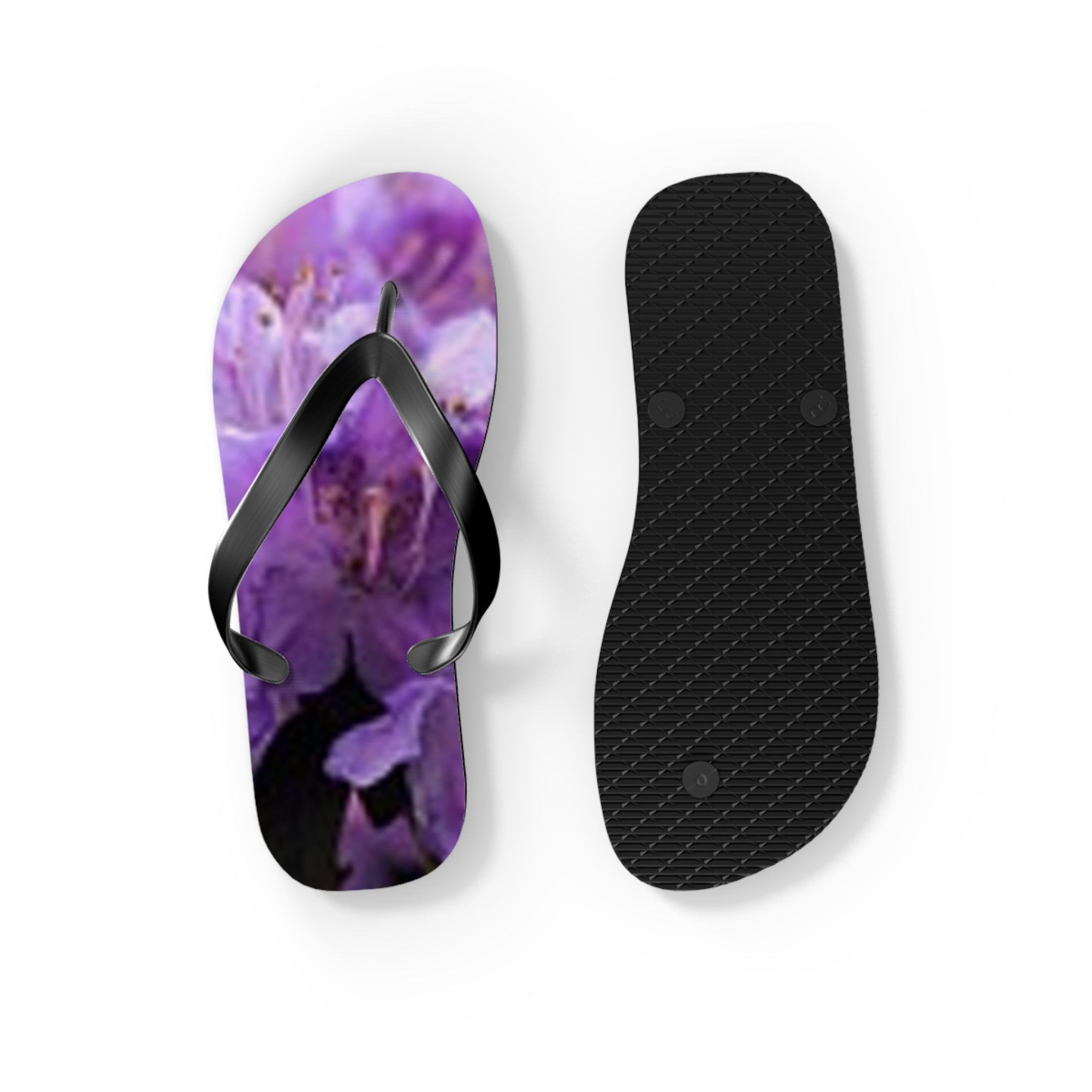 Purple floral flip flops with black straps, shown from above and below.