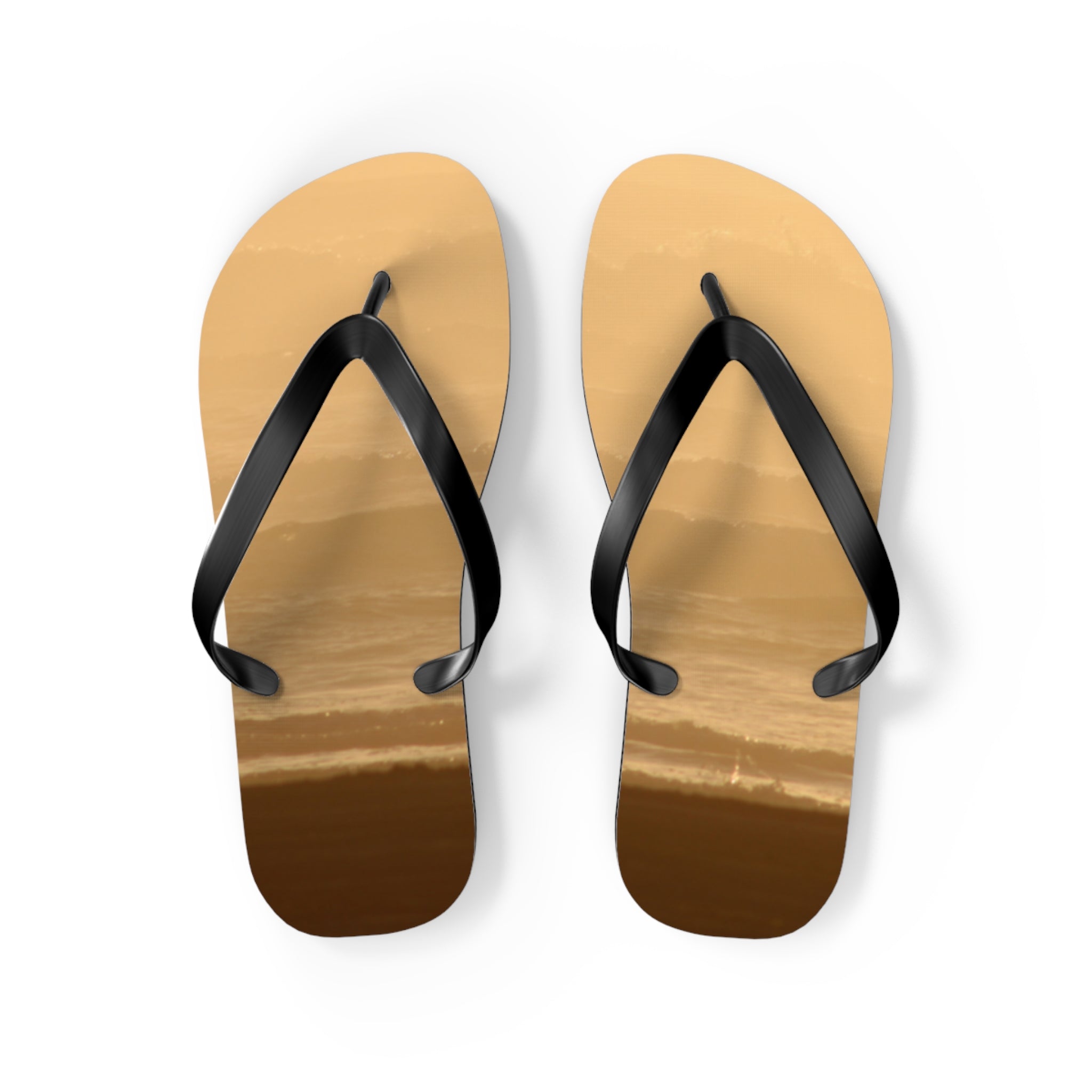 Brown flip-flops with black straps on a white background.