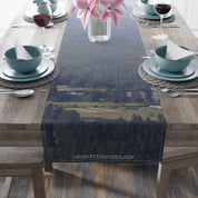 Table runner with a blurred forest and landscape scene, text JKCREATIONFINDS.COM.