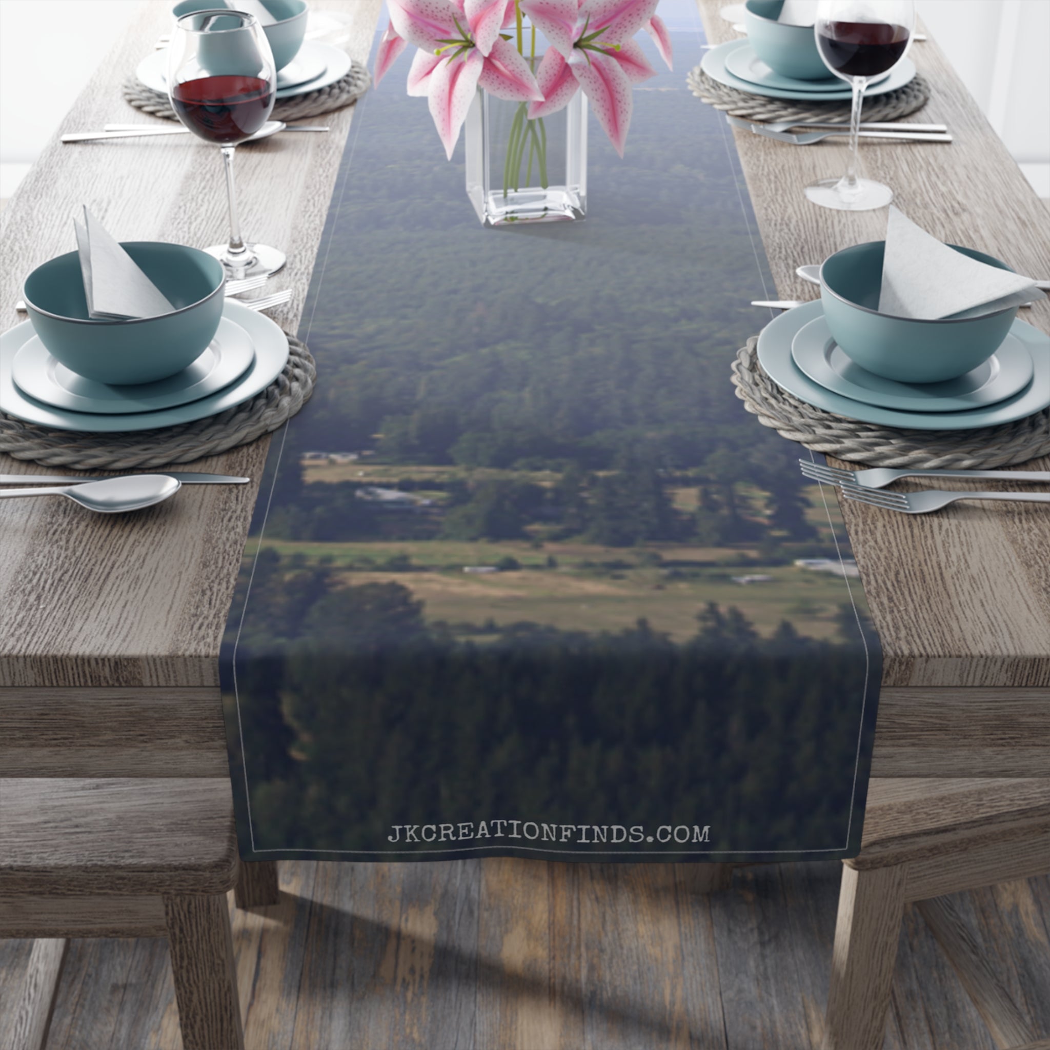Table runner with a blurred forest and landscape scene, text JKCREATIONFINDS.COM.
