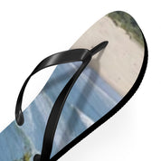 Black flip-flop with a beach scene printed on the sole.