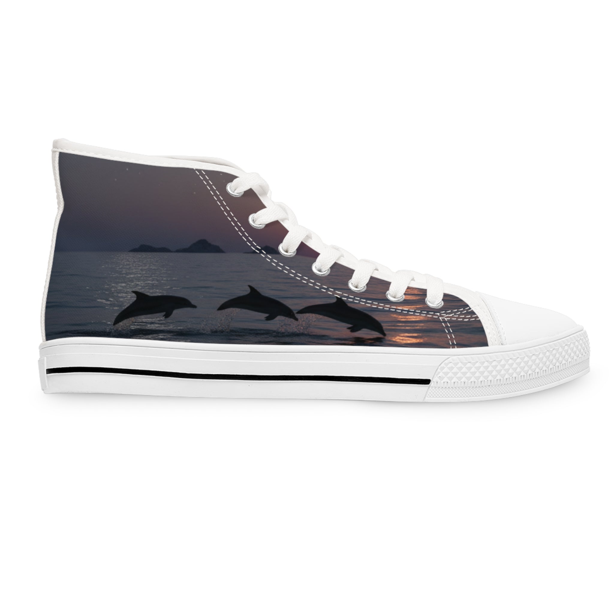 High-top sneaker with three leaping dolphins silhouette on sunset ocean background.
