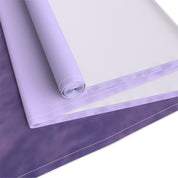 Rolled lavender and purple fabric with white stitching.