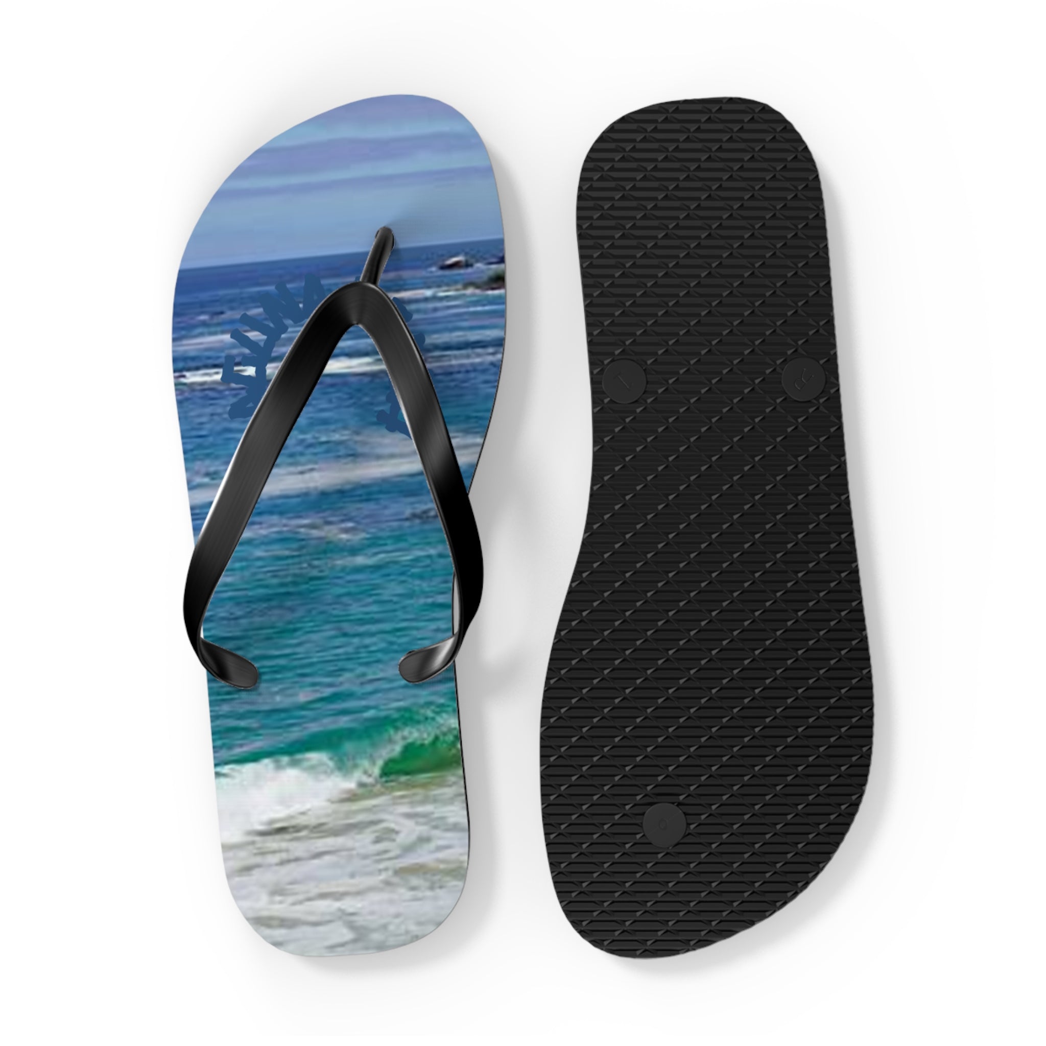 Black flip-flops with ocean wave design on one sole.