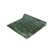 Rolled yoga mat with green leafy pattern and "JKCREATIONFINDS.COM" text.