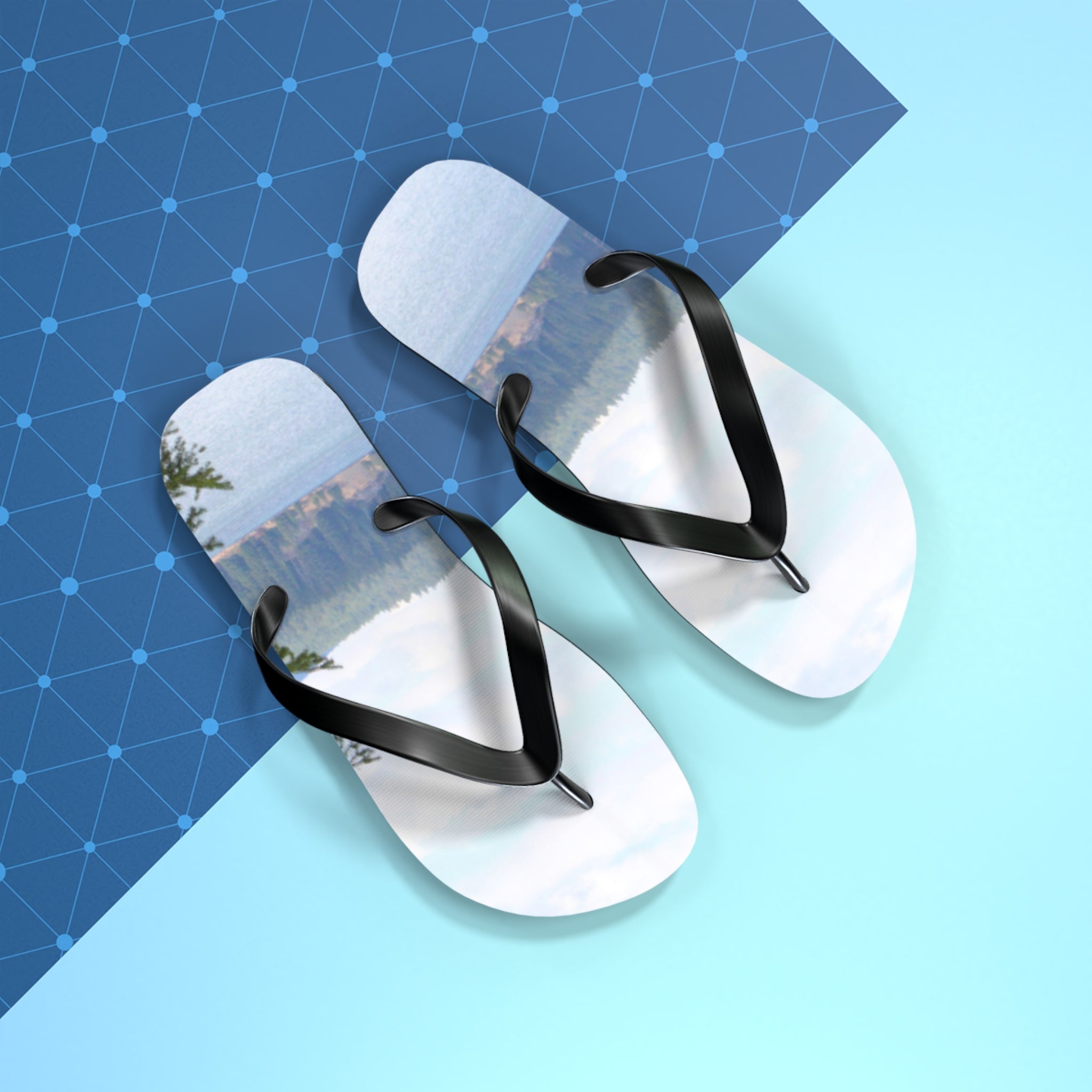 Flip-flops with a scenic lake and forest landscape image on the soles.