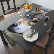 Close-up wolf portrait on a table runner with plates and wine glasses.