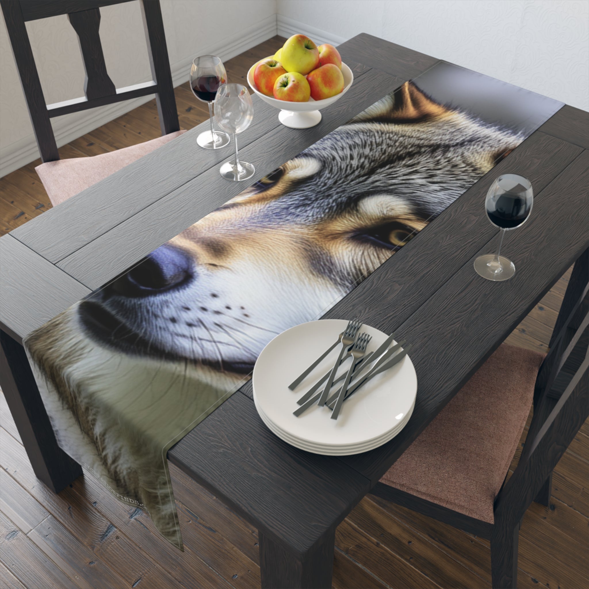 Close-up wolf portrait on a table runner with plates and wine glasses.