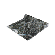 Rolled yoga mat with a close-up winter forest scene and JKCREATIONFINDS.COM