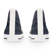 Pair of high-top sneakers with a dark wave and sunset graphic.