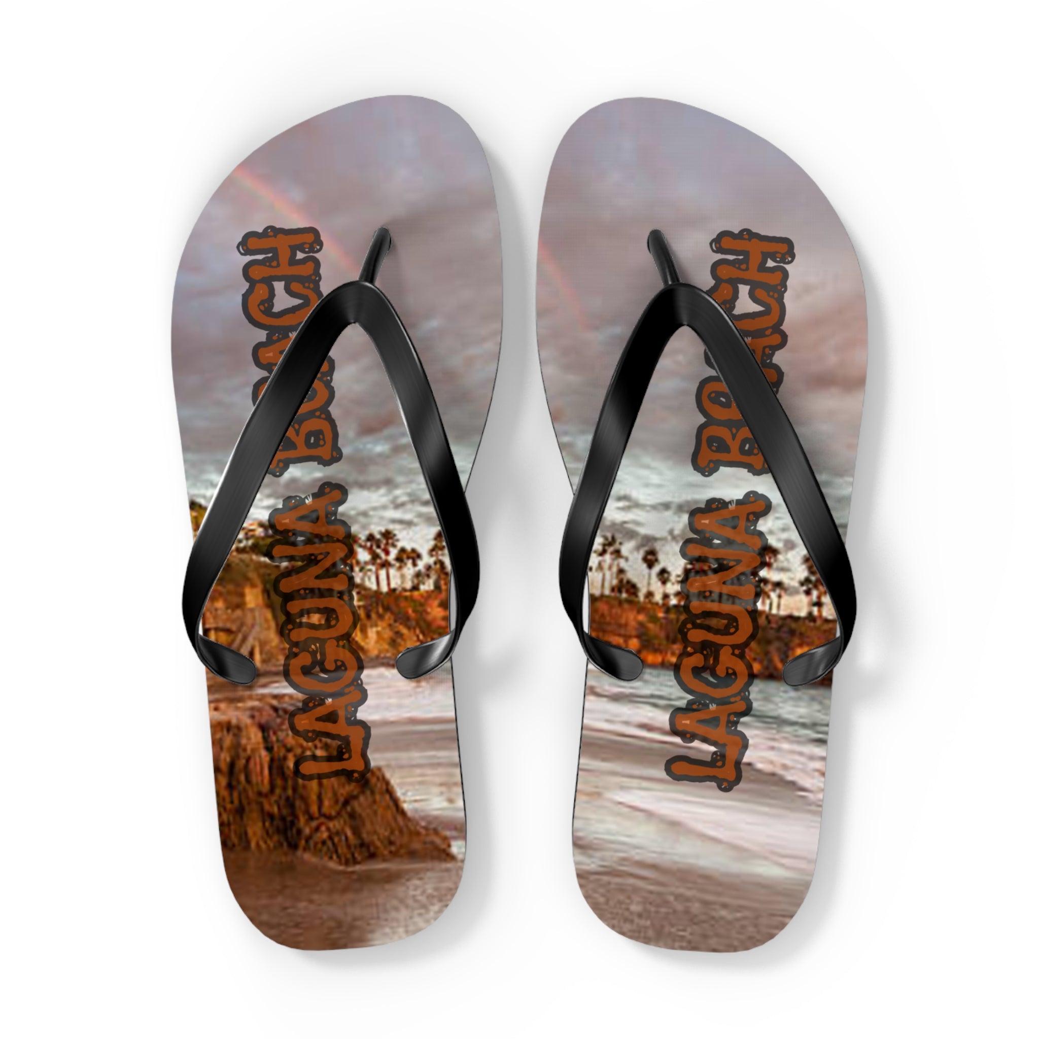 Flip-flops with "Laguna Beach" text and palm trees on tropical shoreline.