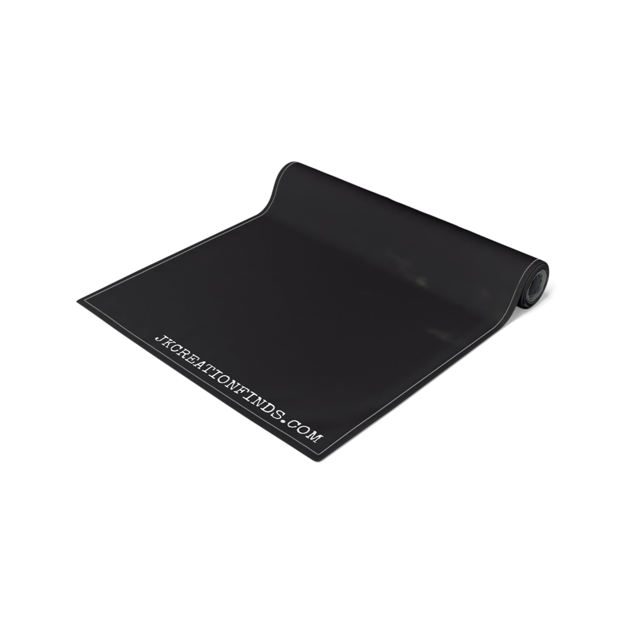 Black yoga mat with white stitching and JKCREATIONFINDS.COM logo.