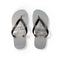 Flip-flops with a beach and ocean wave scene printed on the soles.
