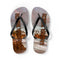 Flip-flops with "Laguna Beach" text on a beach landscape design.