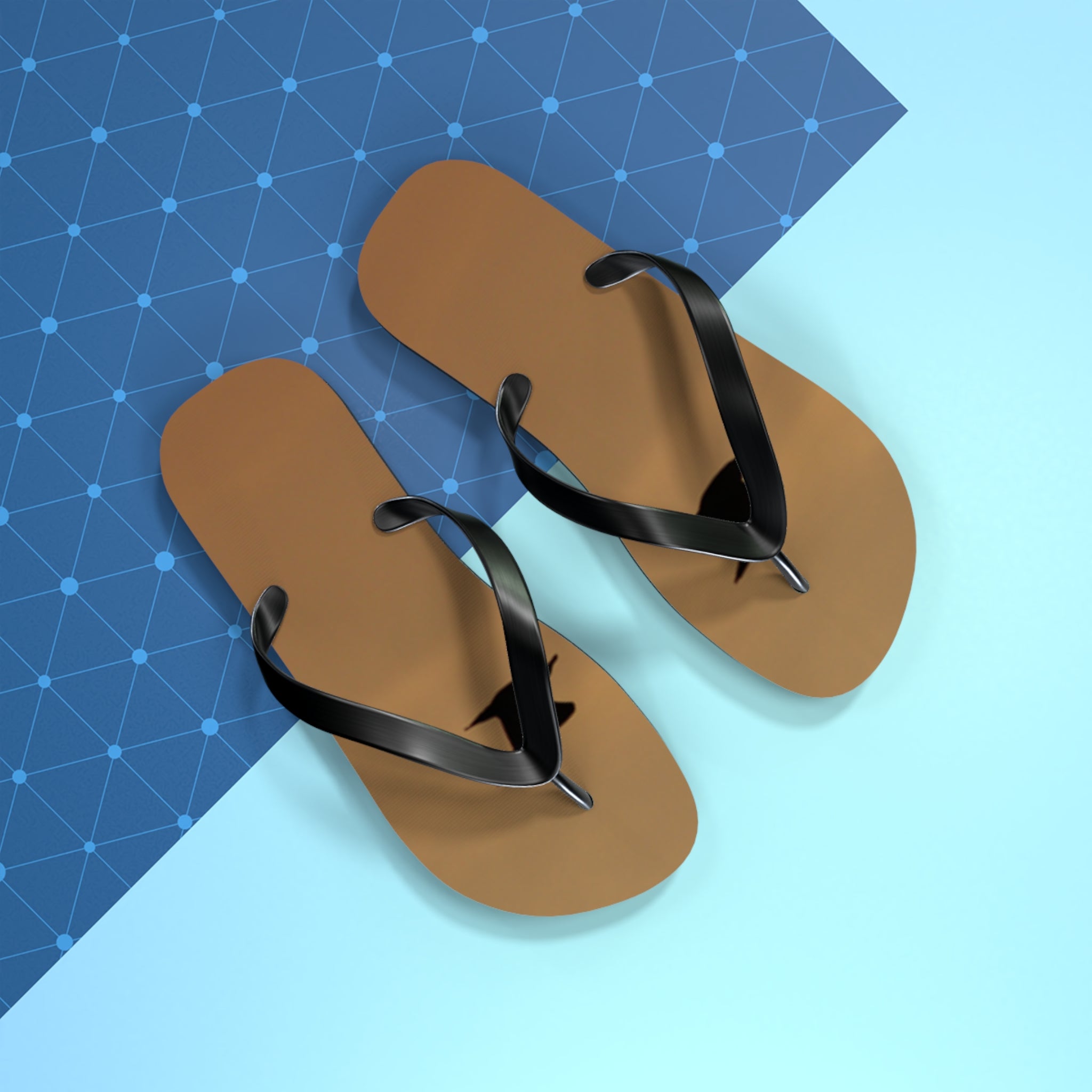 Brown flip-flops with black straps on a blue and light blue background.