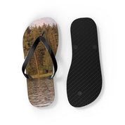 Flip flops with a forest and lake scene on one, black sole on the other.