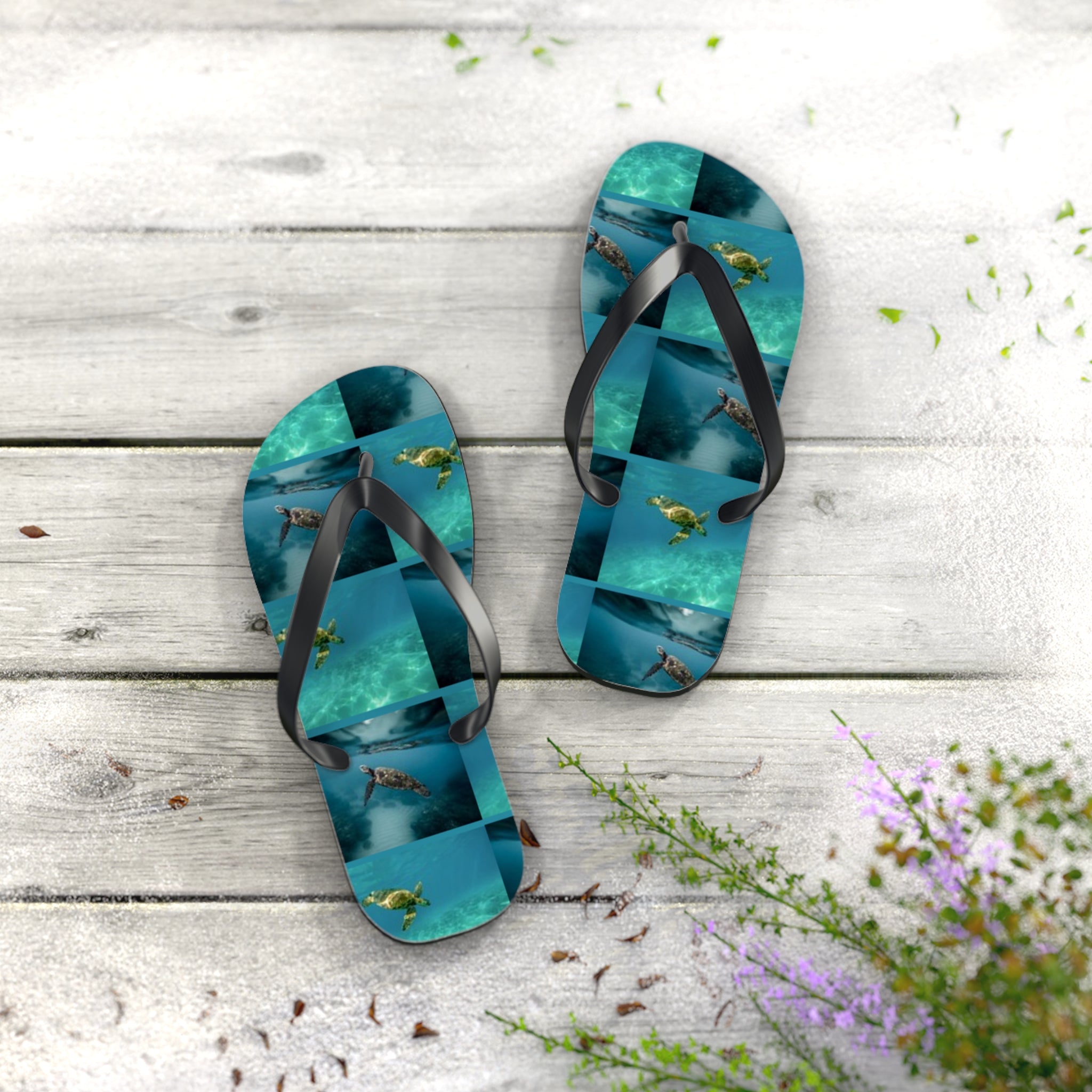 Flip-flops with a collage of sea turtles swimming in blue water.