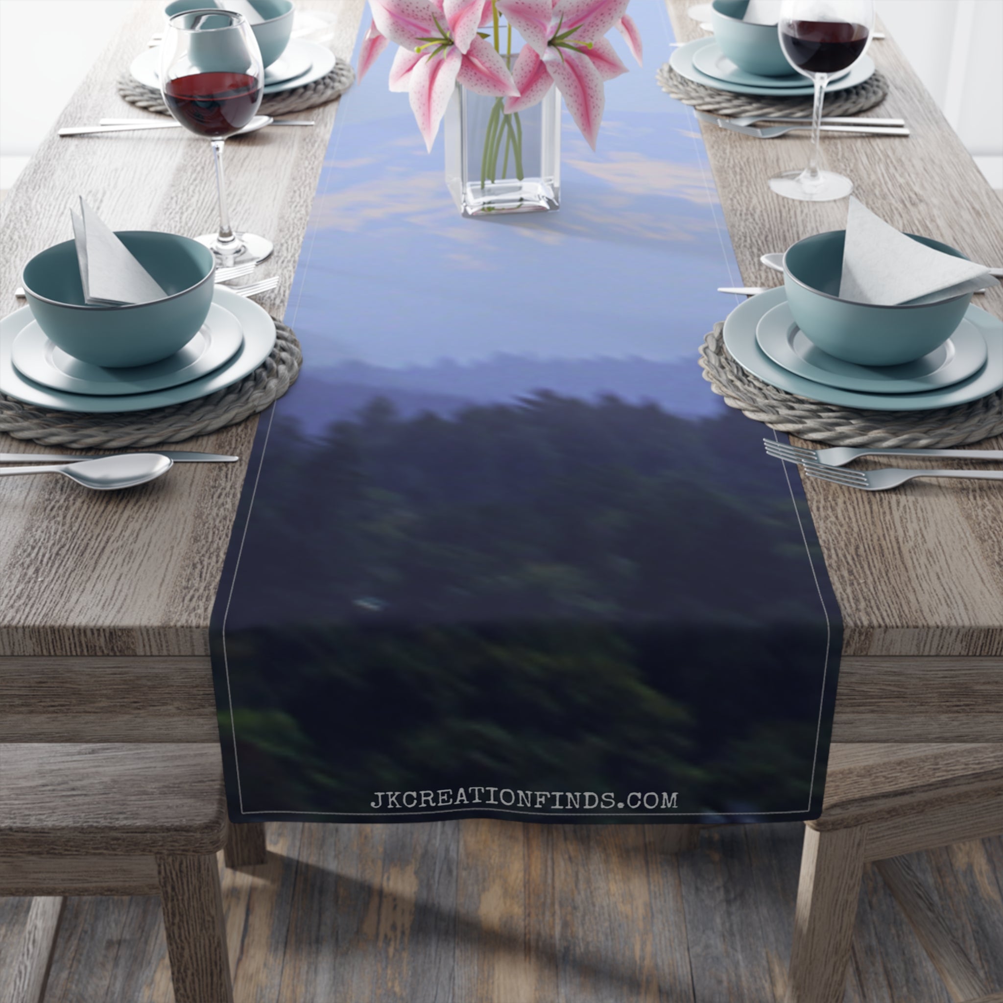 Table runner featuring a blurred forest and sky landscape with a watermark.