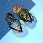 Flip-flops with "LB" logo and tropical scenery of palm trees and plants.