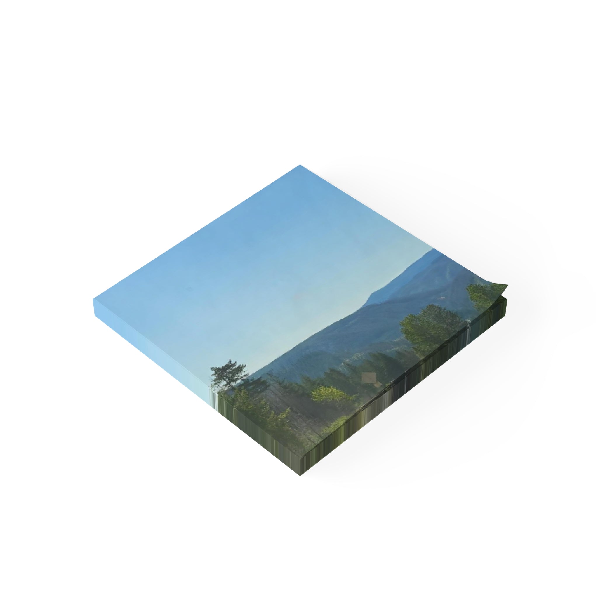 Layered diorama of a mountain landscape with trees and sky.