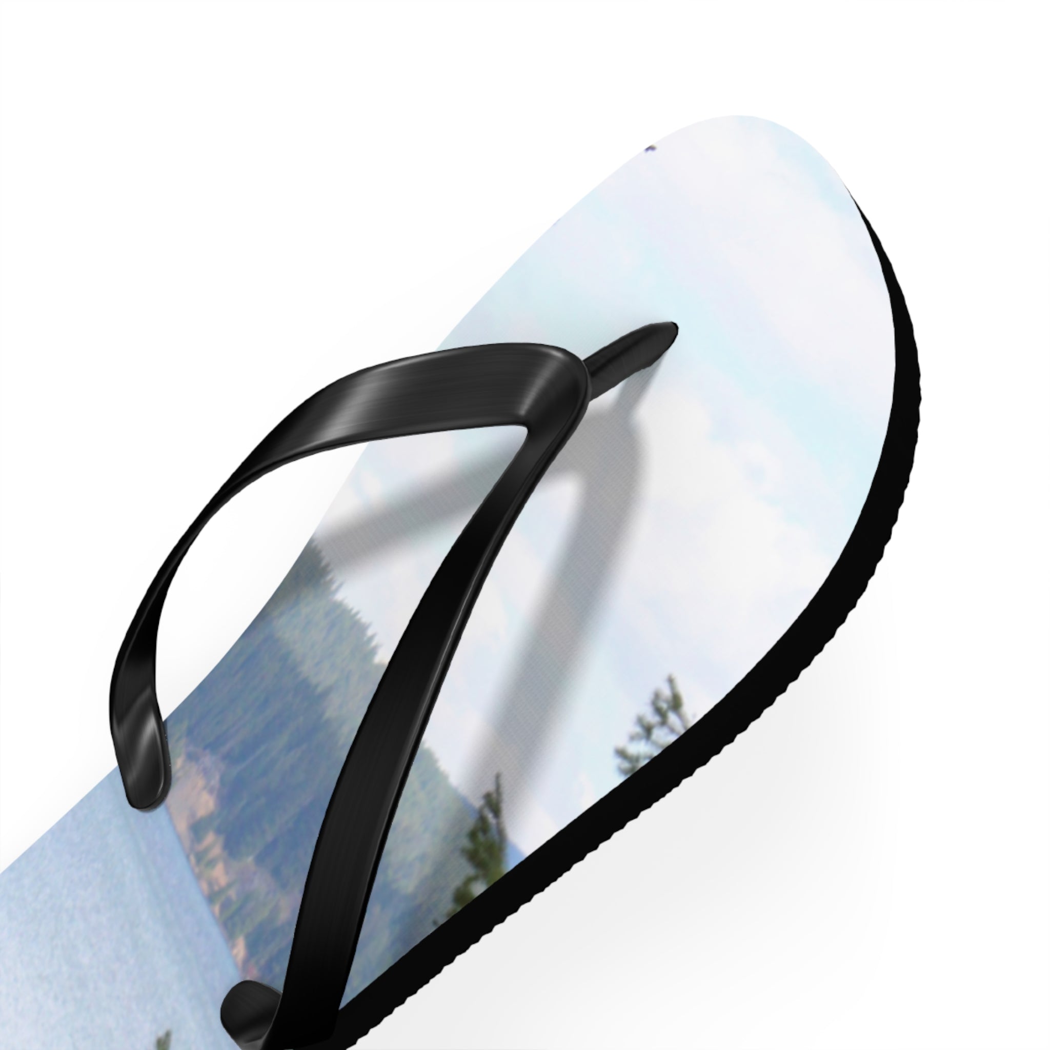 Flip-flop with a landscape scene on the sole, white background.