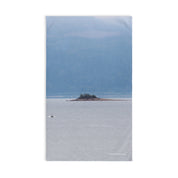 Serene island in calm waters scene with mountains product