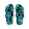 Flip-flops with a repeating pattern of sea turtles swimming in clear water.