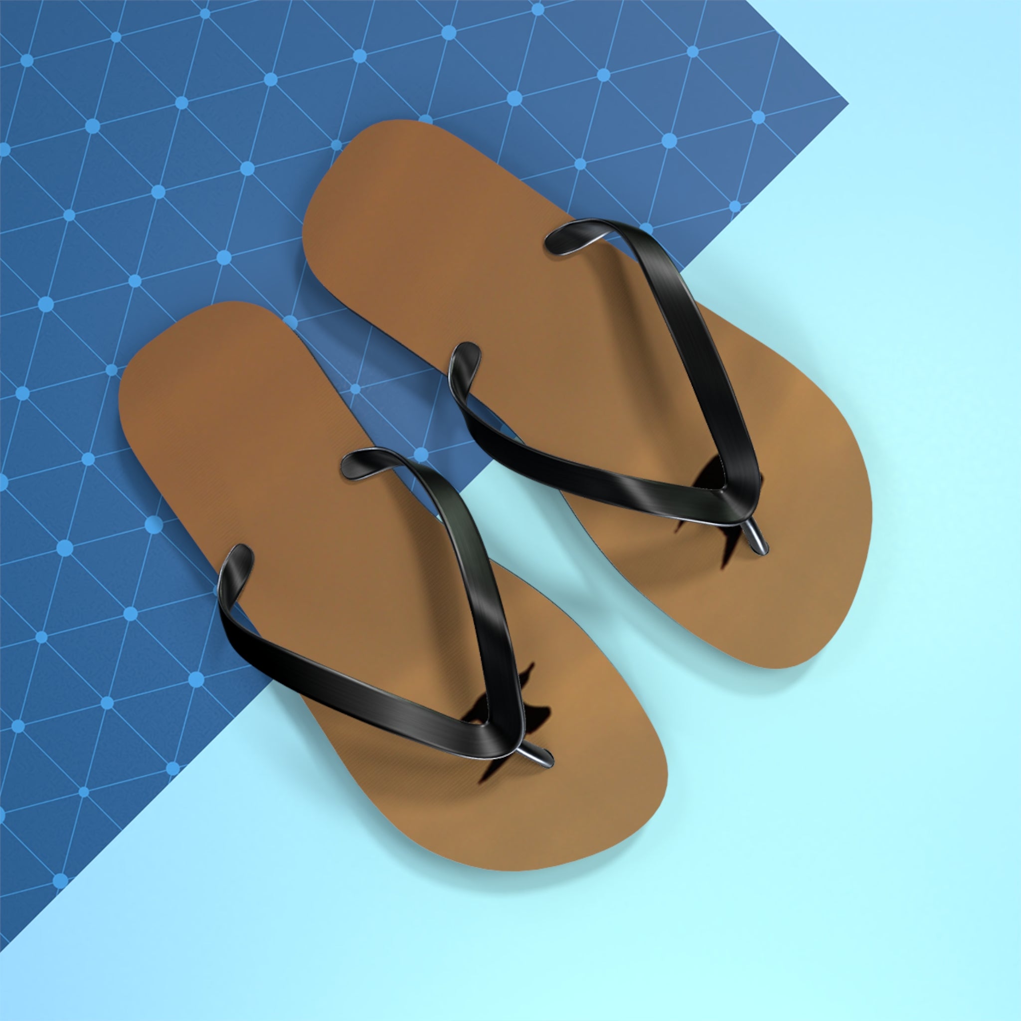 Brown flip-flops with black straps on a blue and light blue background.