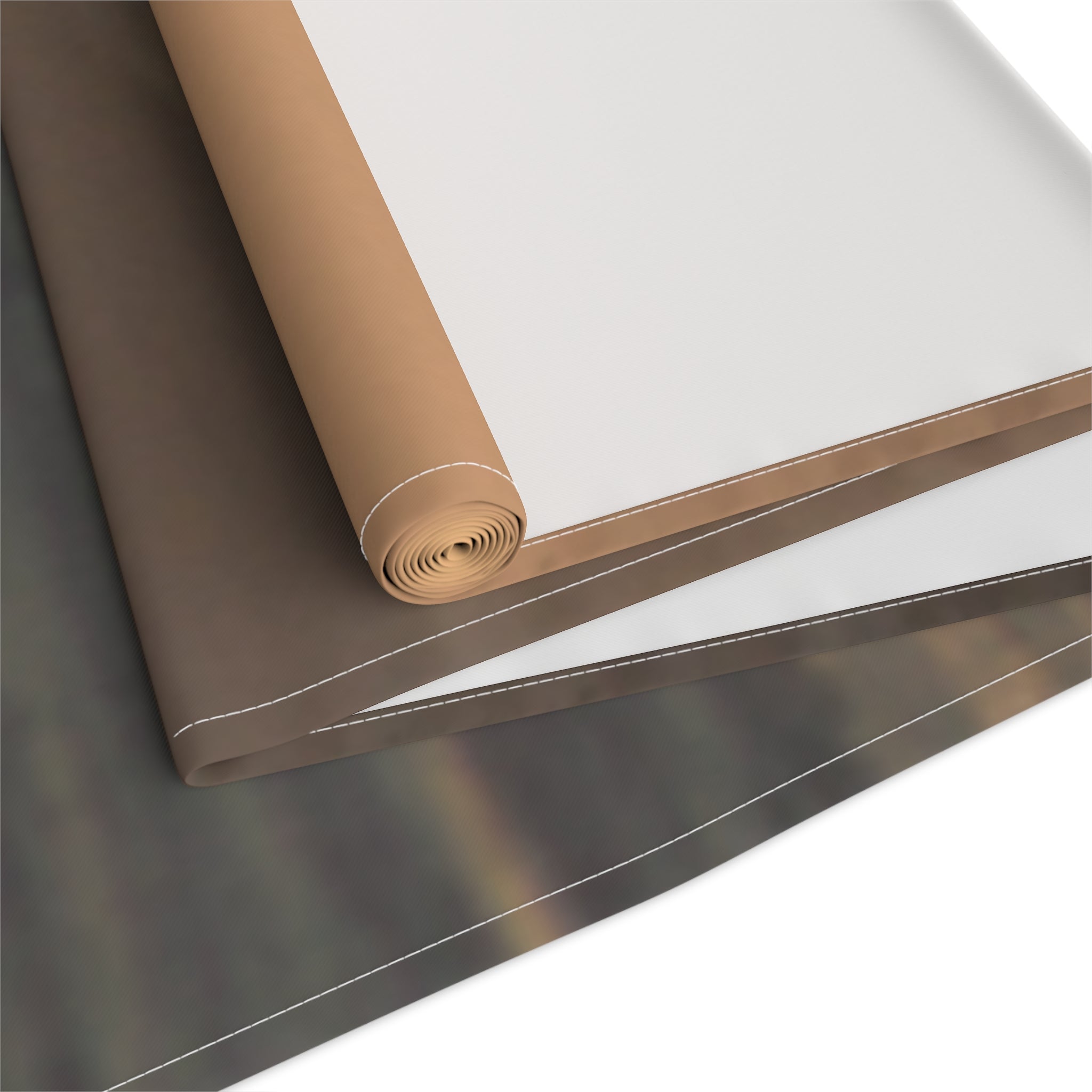 Rolled fabric swatch showing white, brown, and dark patterned material.
