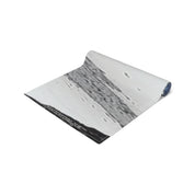 Rolled-up rug with "KOREATONFINDS.COM" printed on the edge.