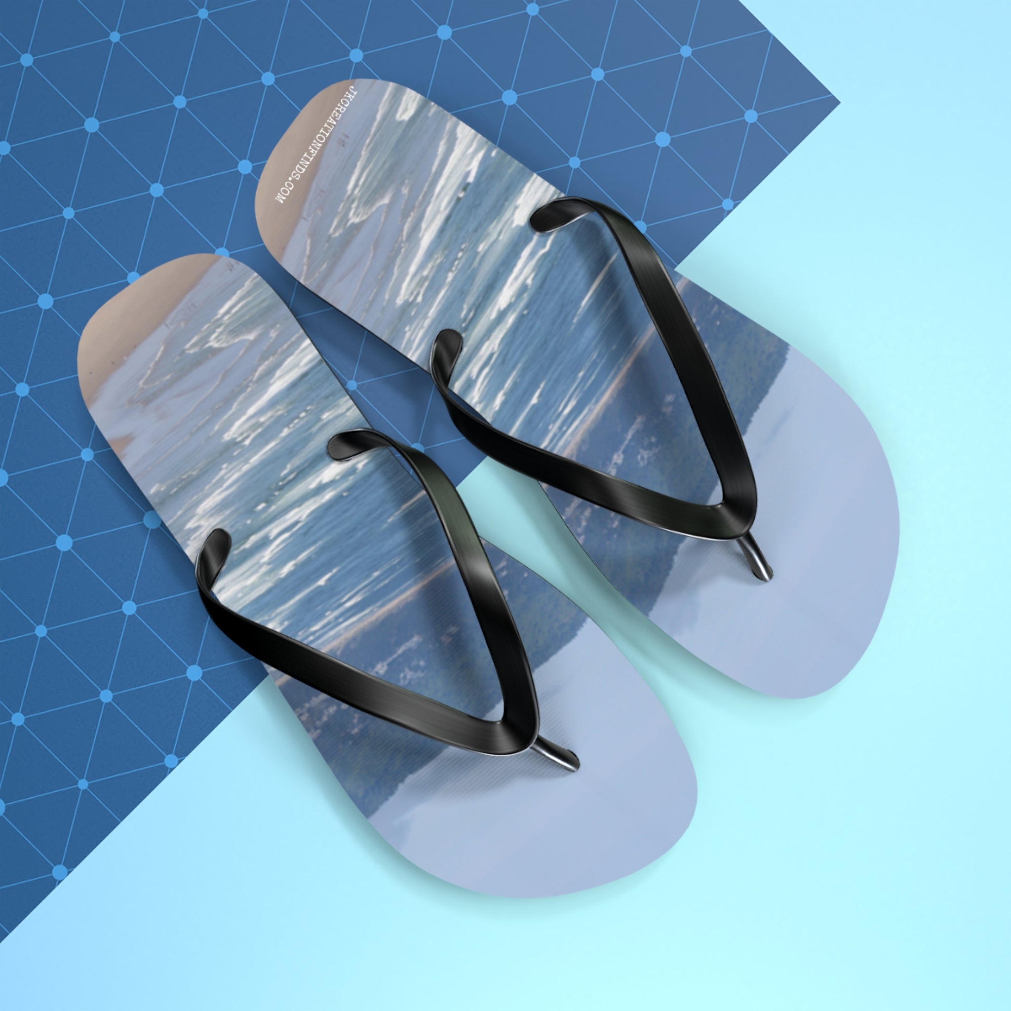Flip-flops with a seascape and grid pattern on blue background.