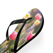 Flip-flop with pink and yellow tulips and purple flowers.