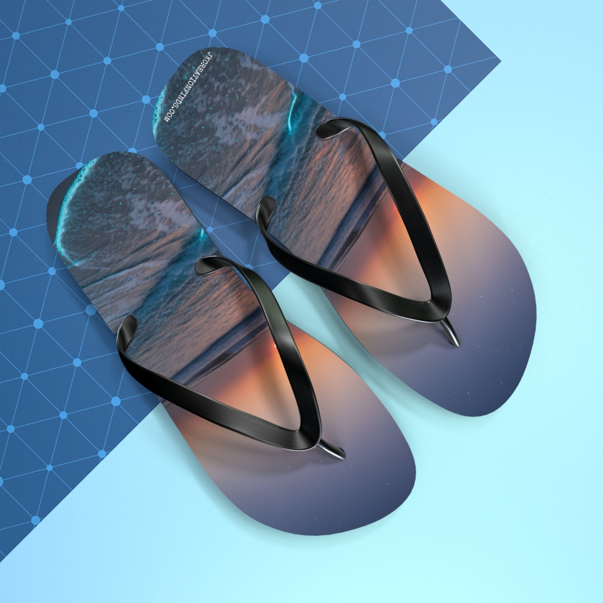 Flip-flops with an ocean sunset wave design.