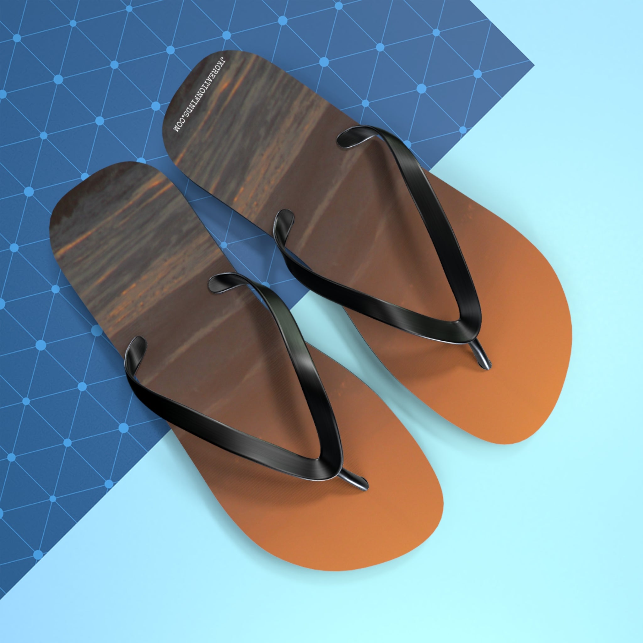 Flip-flops with a wood grain pattern and black straps on a blue background.