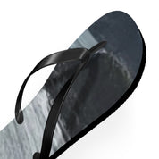 Black flip-flop with a dark, abstract mountainous landscape on the sole.