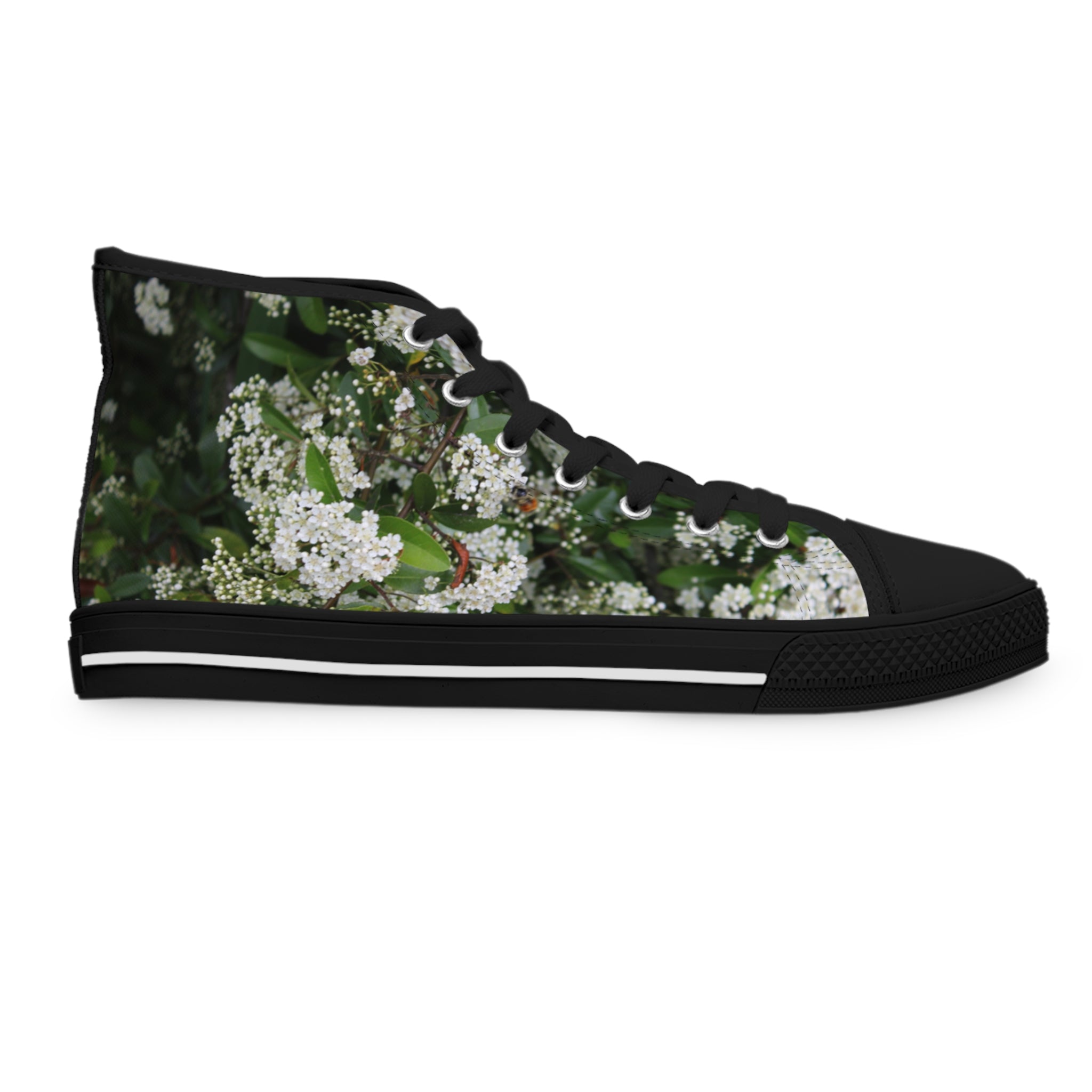 Black high-top sneaker with a white floral pattern and black laces.