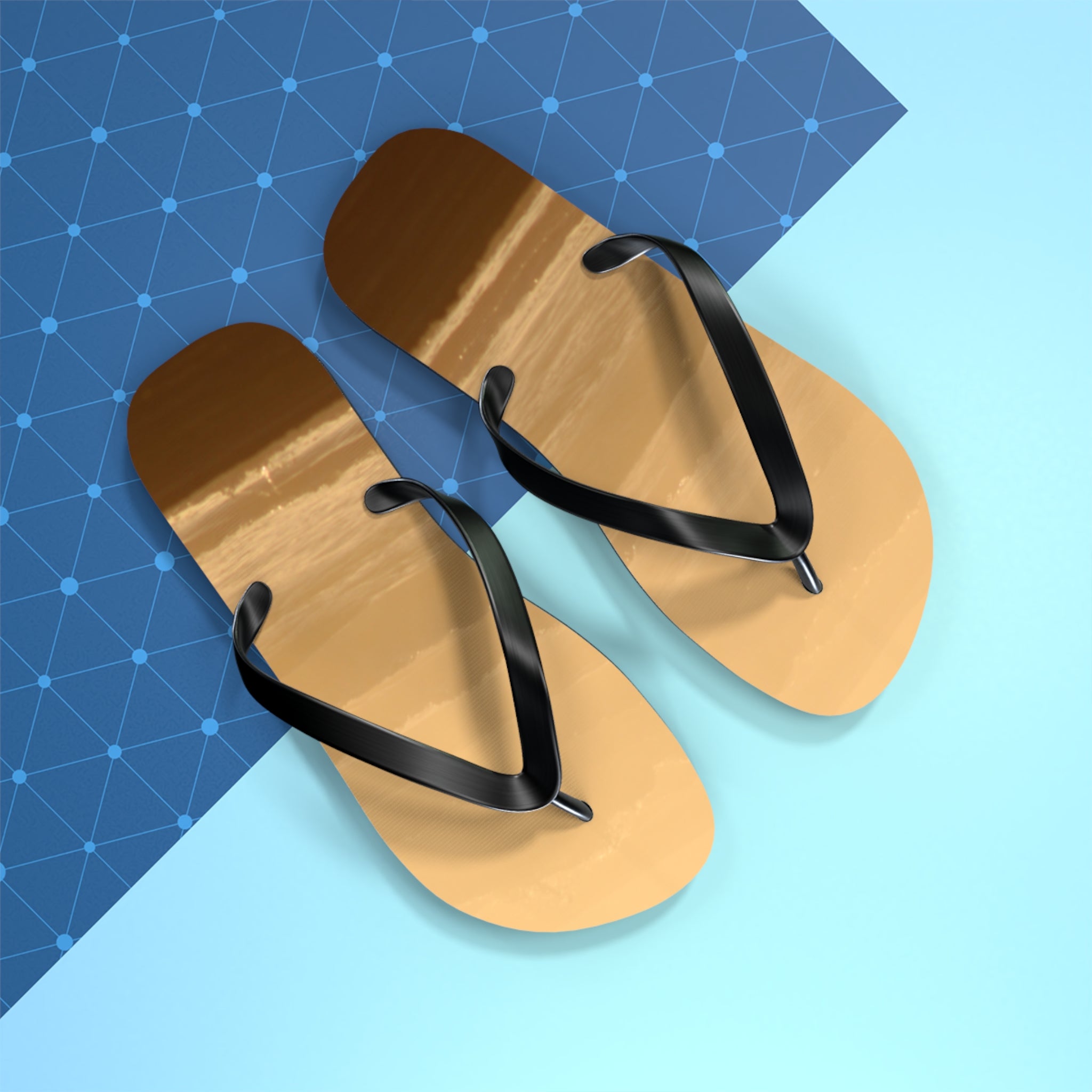 Brown flip-flops with black straps on a blue and white background.