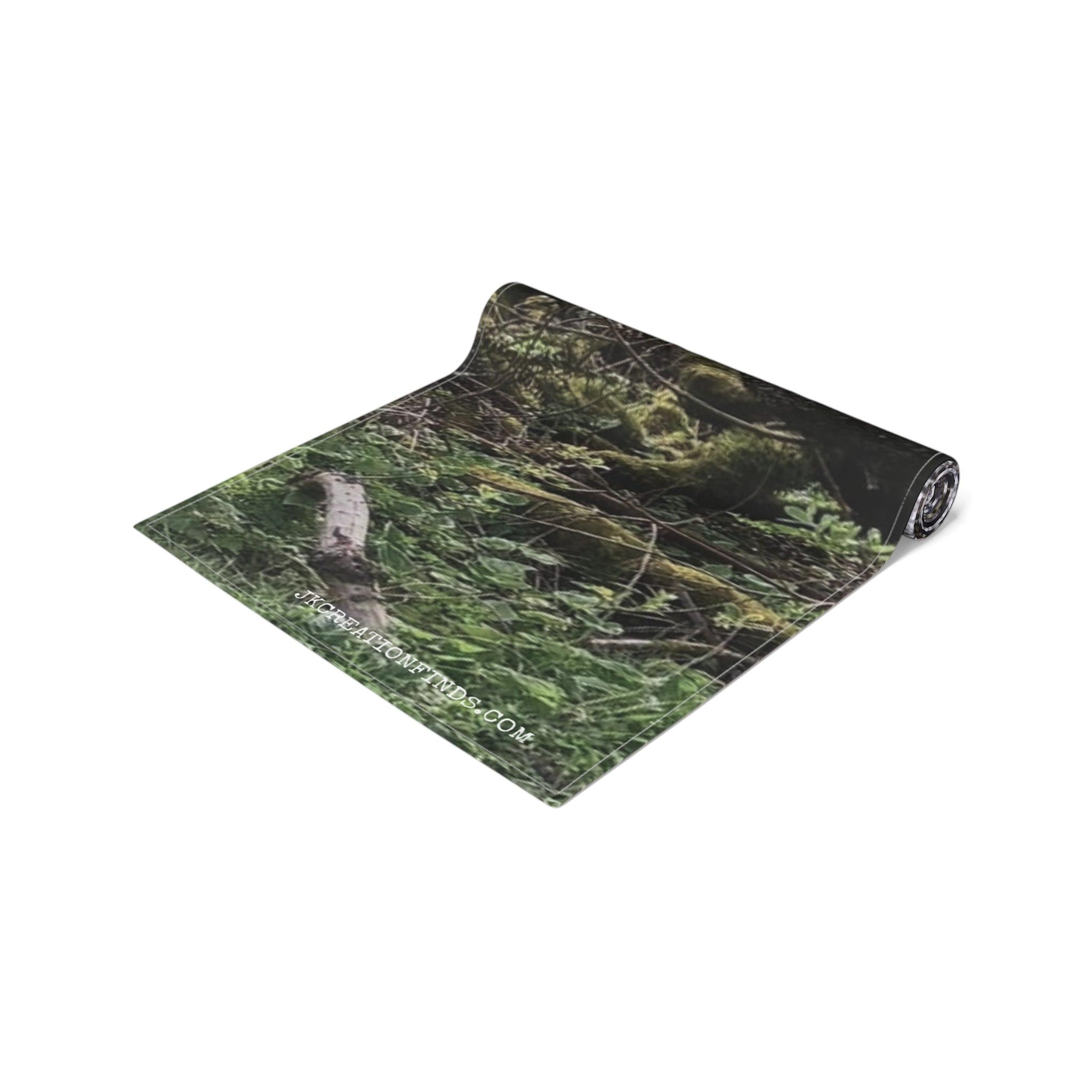 Yoga mat with a forest design, unrolled with the "RECREATIONFINDS.COM" text visible.