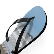 Blue flip-flop with a scenic landscape printed on the sole.
