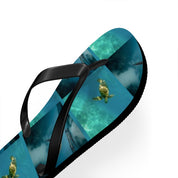 Flip-flops with sea turtles swimming in clear turquoise water.