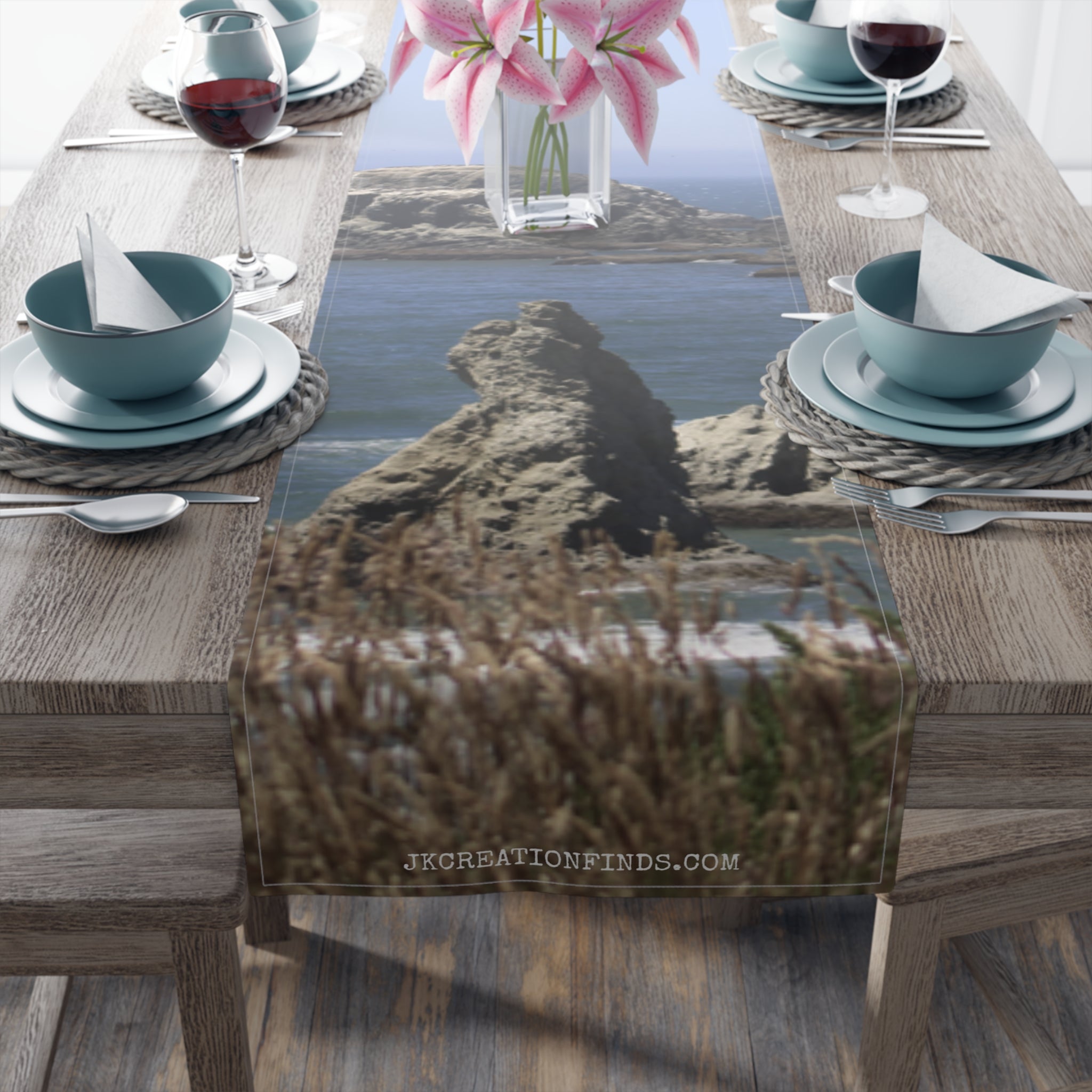 Coastal rock formation with water, on a table runner with website address.